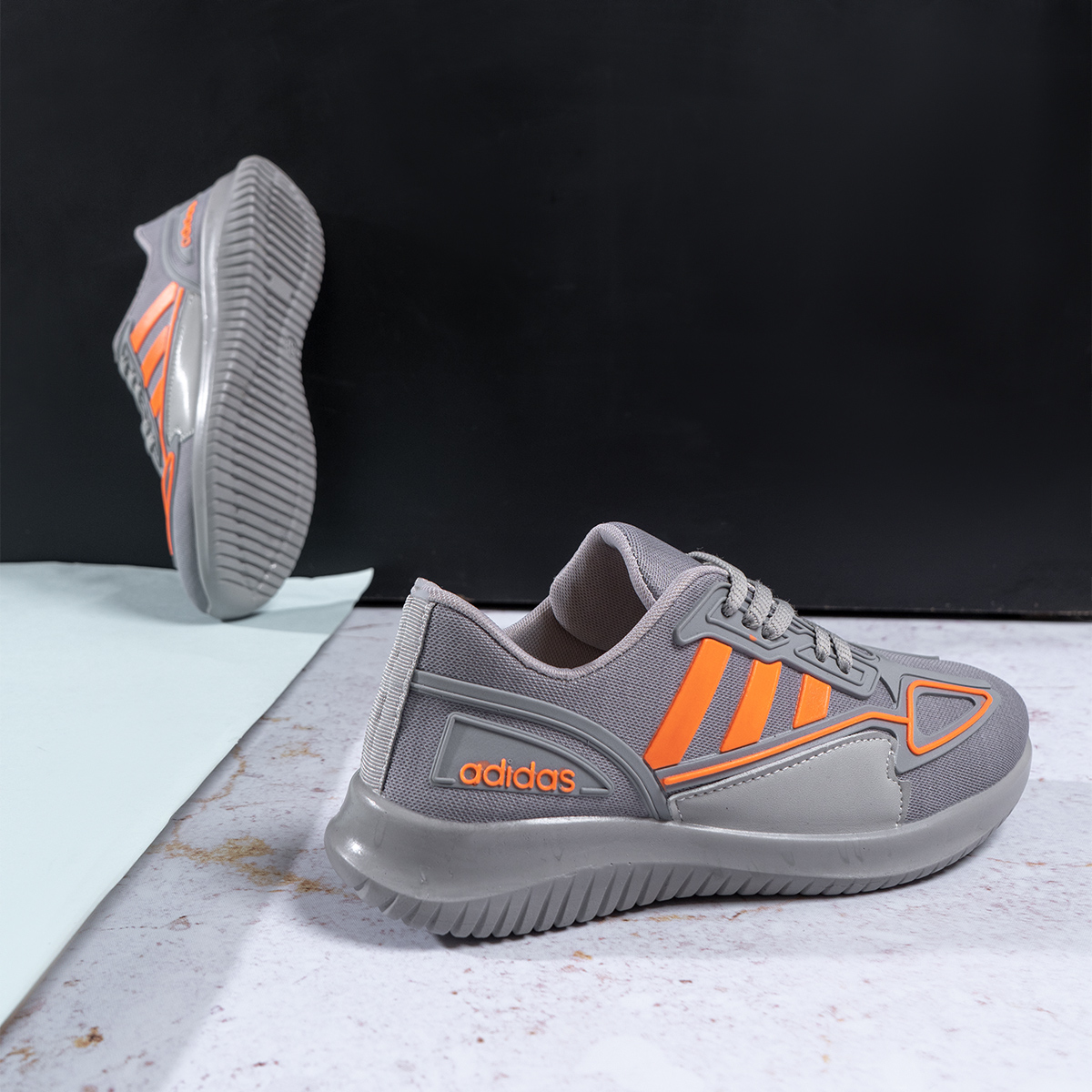 کفش ورزشی Adidas دخترانه طوسی نارنجی مدل Kiana